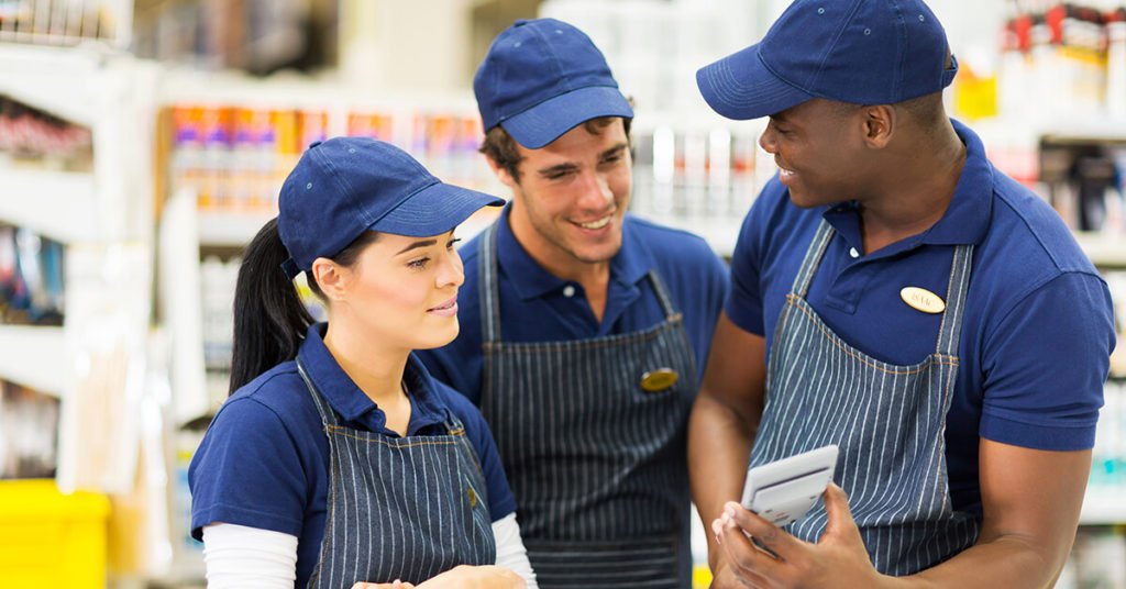 Happy employees looking at phone